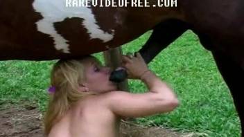 Gorgeous blonde with a tramp stamp fucks a hung horse
