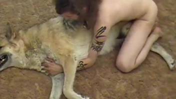 Tattooed owner and sexy white dog in awesome homemade animality