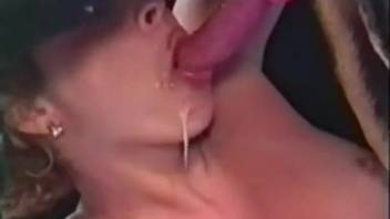 Blonde vixen fellating a canine's enormous penis live on webcam