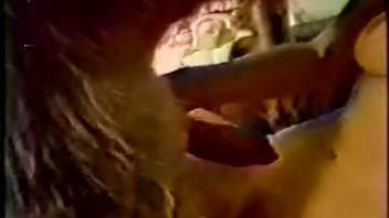 Slender woman with an attractive face is fooling around with a puppy