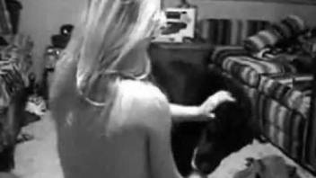 Nude female caught on cam when having sex with a dog