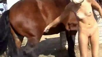 Intense outdoor bestiality featuring a horny blonde spouse and horses