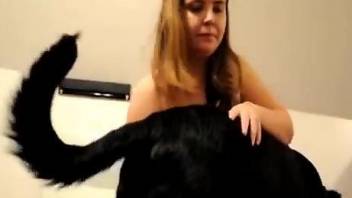 Chubby wife sucking on a black dog's hard cock