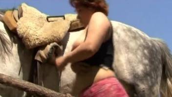 Big-ass redhead zoophile bangs with horse and dog