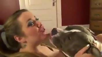 Pigtailed diva with slutty makeup makes out with a dog